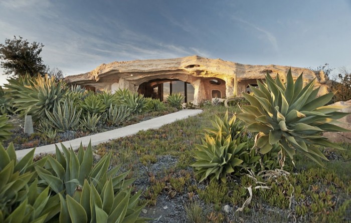 77949953_flintstones-style-house-mountain-rock-building_xyo